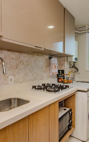 Apartamento à venda com 48m², 2 quartos e 1 vaga Apartamento à venda com 48m², 2 quartos e 1 vagaCozinha e Área de Serviço