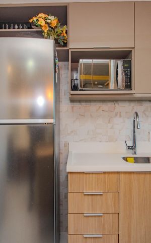 Apartamento à venda com 48m², 2 quartos e 1 vaga Apartamento à venda com 48m², 2 quartos e 1 vagaCozinha e Área de Serviço