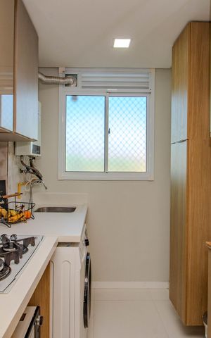Apartamento à venda com 48m², 2 quartos e 1 vaga Apartamento à venda com 48m², 2 quartos e 1 vagaCozinha e Área de Serviço