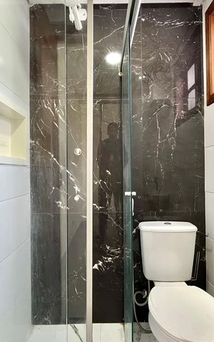 Casa de condomínio à venda com 60m², 2 quartos e 1 vaga Casa de condomínio à venda com 60m², 2 quartos e 1 vagaBanheiro da Suíte 1