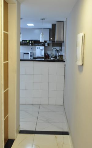 Casa de condomínio à venda com 145m², 2 quartos e 1 vagaCorredor Cozinha