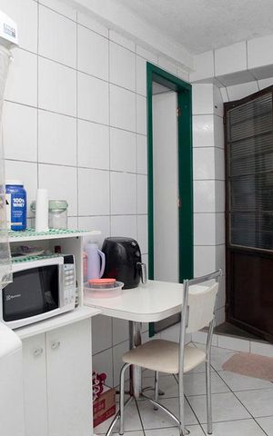 Apartamento à venda com 77m², 2 quartos e sem vagaCozinha + Área de Serviço 2