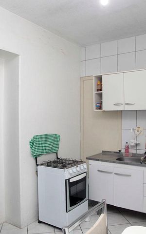 Apartamento à venda com 77m², 2 quartos e sem vagaCozinha + Área de Serviço 2