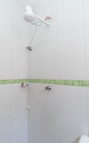 Casa de condomínio à venda com 113m², 2 quartos e 3 vagasBanheiro da Suíte 1