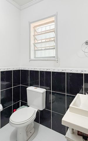 Casa à venda com 150m², 3 quartos e 2 vagas Casa à venda com 150m², 3 quartos e 2 vagasBanheiro da Suíte 1