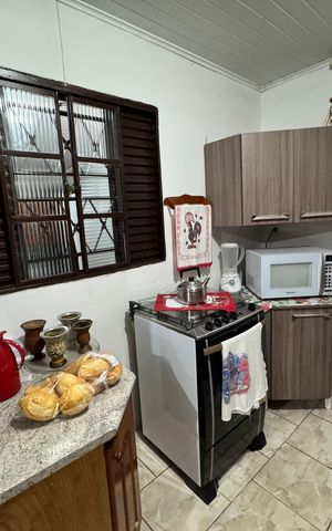 Casa à venda com 120m², 2 quartos e 2 vagas Casa à venda com 120m², 2 quartos e 2 vagasCozinha