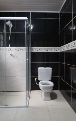 Casa à venda com 125m², 4 quartos e 3 vagasBanheiro Casa 1
