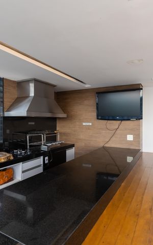 Studio à venda com 70m², 1 quarto e 2 vagas Studio à venda com 70m², 1 quarto e 2 vagasÁrea comum - Churrasqueira