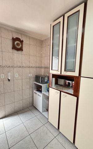Casa à venda com 128m², 4 quartos e 4 vagas Casa à venda com 128m², 4 quartos e 4 vagasCozinha