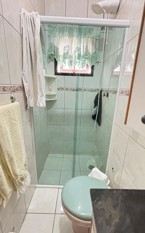 Casa à venda com 128m², 4 quartos e 4 vagas Casa à venda com 128m², 4 quartos e 4 vagasBanheiro da Suíte 2