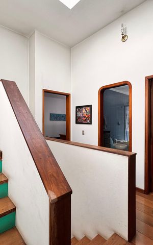 Casa à venda com 230m², 4 quartos e 3 vagasCorredor acesso aos quartos e suíte