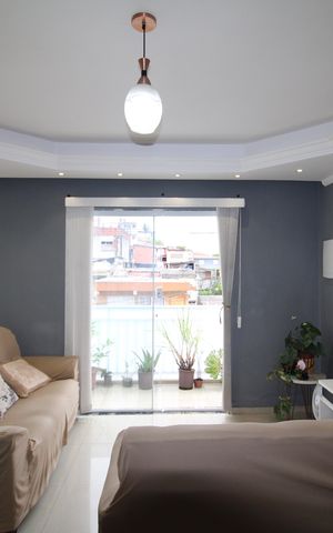 Casa à venda com 129m², 2 quartos e 2 vagasSala