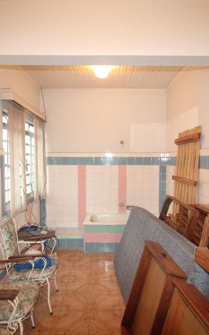 Casa à venda com 265m², 8 quartos e 5 vagasCasa 1 - Área de Serviço