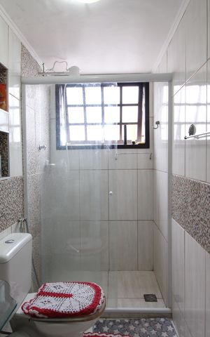 Casa de condomínio à venda com 250m², 4 quartos e 3 vagasBanheiro Social