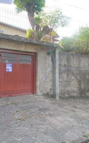 Casa à venda com 100m², 3 quartos e 1 vaga Casa à venda com 100m², 3 quartos e 1 vagaFachada e Placa