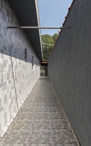 Casa à venda com 70m², 2 quartos e 2 vagas Casa à venda com 70m², 2 quartos e 2 vagasCorredor Externo
