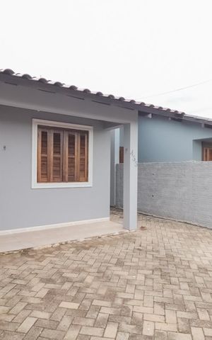 Casa à venda com 55m², 2 quartos e 3 vagas Casa à venda com 55m², 2 quartos e 3 vagasFachada