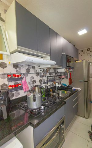 Apartamento à venda com 48m², 2 quartos e 1 vaga Apartamento à venda com 48m², 2 quartos e 1 vagaCozinha e Área de Serviço