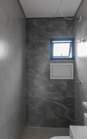 Casa à venda com 107m², 3 quartos e 2 vagasBanheiro