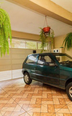Casa à venda com 130m², 4 quartos e 2 vagas Casa à venda com 130m², 4 quartos e 2 vagasGaragem