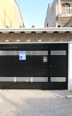 Casa para alugar com 125m², 2 quartos e 2 vagasFachada/Placa