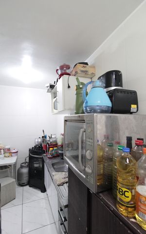 Casa de condomínio à venda com 60m², 2 quartos e 1 vagaCozinha e Área de Serviço