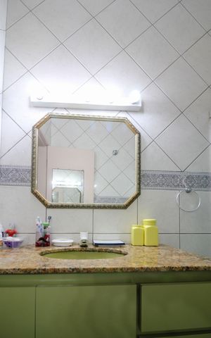 Casa à venda com 346m², 4 quartos e 3 vagasBanheiro Suíte 2