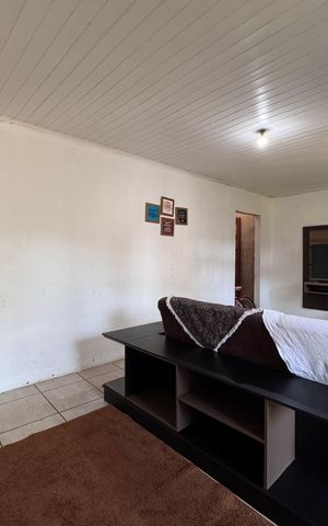 Casa à venda com 128m², 2 quartos e 2 vagasSala