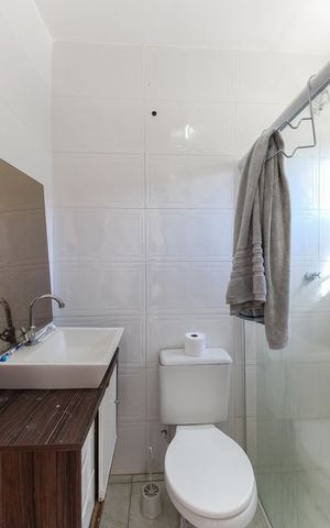 Casa à venda com 125m², 2 quartos e 2 vagasBanheiro do Suíte 1