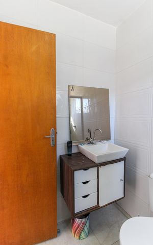 Casa à venda com 125m², 2 quartos e 2 vagasBanheiro do Suíte 1