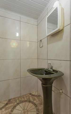 Casa à venda com 200m², 4 quartos e 2 vagas Casa à venda com 200m², 4 quartos e 2 vagasBanheiro da Suíte