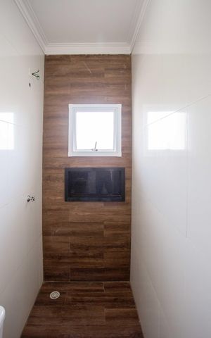 Casa à venda com 130m², 2 quartos e 2 vagasBanheiro da Suíte 1