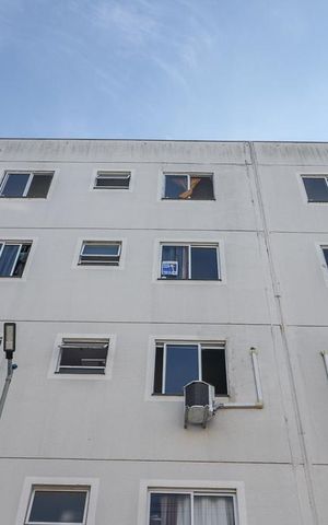 Apartamento à venda com 47m², 2 quartos e 1 vagaFachada do bloco e placa