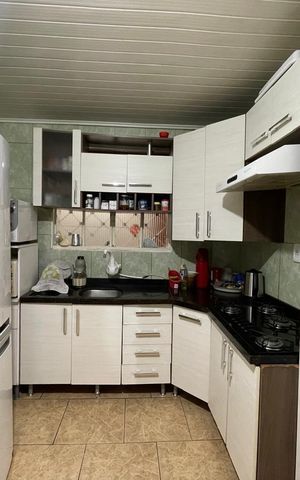 Casa à venda com 90m², 2 quartos e 2 vagas Casa à venda com 90m², 2 quartos e 2 vagasCozinha