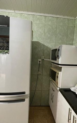 Casa à venda com 90m², 2 quartos e 2 vagas Casa à venda com 90m², 2 quartos e 2 vagasCozinha