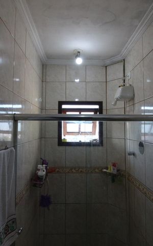 Casa à venda com 356m², 3 quartos e 2 vagasBanheiro da Suíte 1