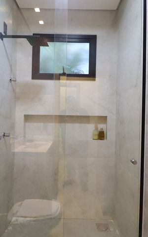 Casa de condomínio para alugar com 400m², 2 quartos e 4 vagasBanheiro da Suíte 1