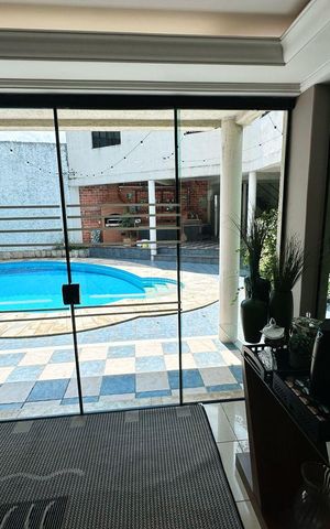Casa de condomínio para alugar com 566m², 3 quartos e 6 vagasSala de Estar 1