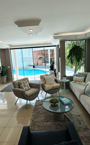 Casa de condomínio para alugar com 566m², 3 quartos e 6 vagasSala de Estar 1