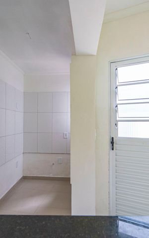 Casa à venda com 46m², 2 quartos e 2 vagas Casa à venda com 46m², 2 quartos e 2 vagasCozinha