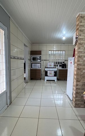 Casa à venda com 160m², 3 quartos e 2 vagas Casa à venda com 160m², 3 quartos e 2 vagasCozinha e Área de Serviço