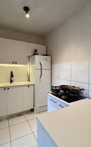 Apartamento à venda com 48m², 2 quartos e 1 vaga Apartamento à venda com 48m², 2 quartos e 1 vagaCozinha e Área de Serviço