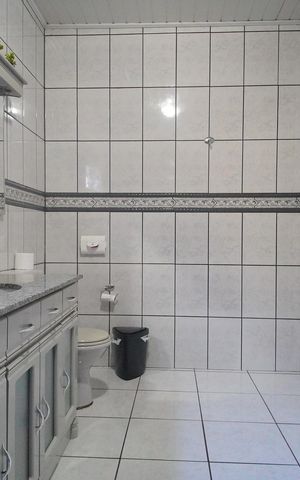 Casa à venda com 264m², 3 quartos e 3 vagasBanheiro da Suíte 1