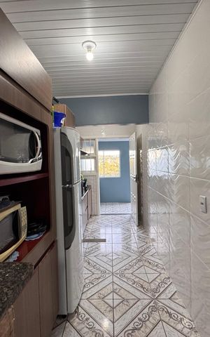 Casa à venda com 78m², 2 quartos e 2 vagas Casa à venda com 78m², 2 quartos e 2 vagasCozinha