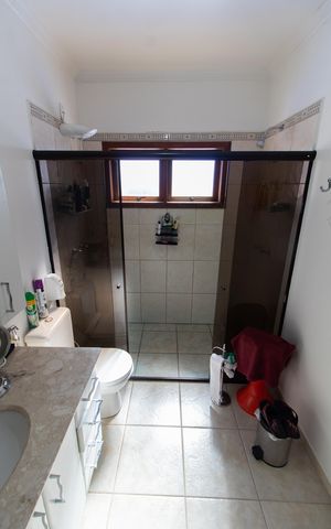 Casa de condomínio para alugar com 283m², 3 quartos e 10 vagasBanheiro da Suíte 3