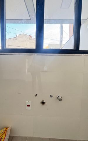Casa à venda com 70m², 2 quartos e 2 vagas Casa à venda com 70m², 2 quartos e 2 vagasSala/Cozinha