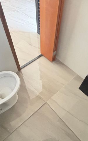 Casa à venda com 70m², 2 quartos e 2 vagas Casa à venda com 70m², 2 quartos e 2 vagasBanheiro da Suíte 1