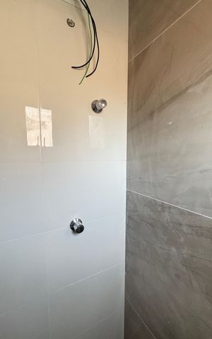 Casa à venda com 70m², 2 quartos e 2 vagas Casa à venda com 70m², 2 quartos e 2 vagasBanheiro da Suíte 2