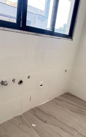 Casa à venda com 70m², 2 quartos e 2 vagas Casa à venda com 70m², 2 quartos e 2 vagasCozinha