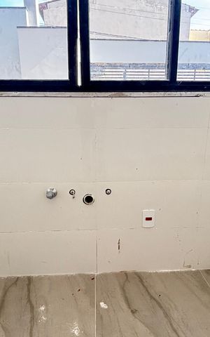 Casa à venda com 70m², 2 quartos e 2 vagas Casa à venda com 70m², 2 quartos e 2 vagasCozinha